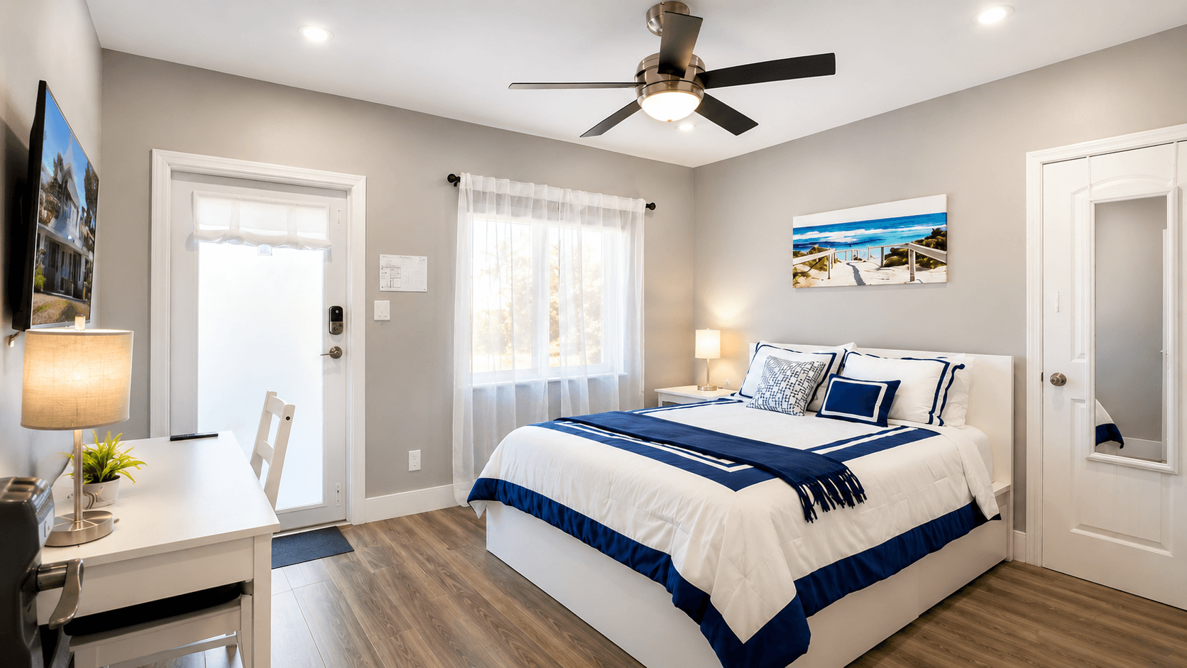 Primary suite with king bed and layered ivory linens